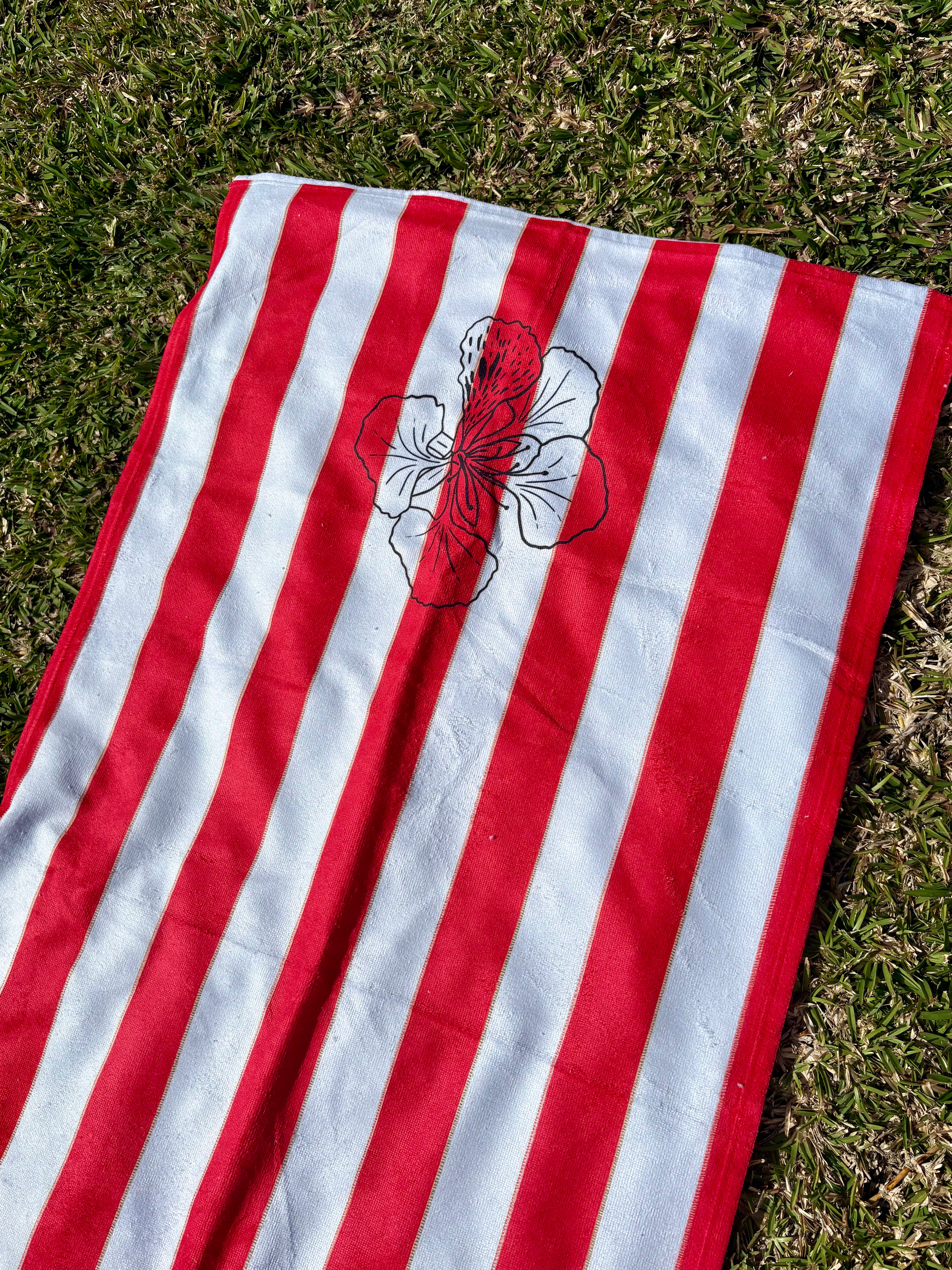 Rouge des îles -- Red Striped Beach Towel with Floral Accent