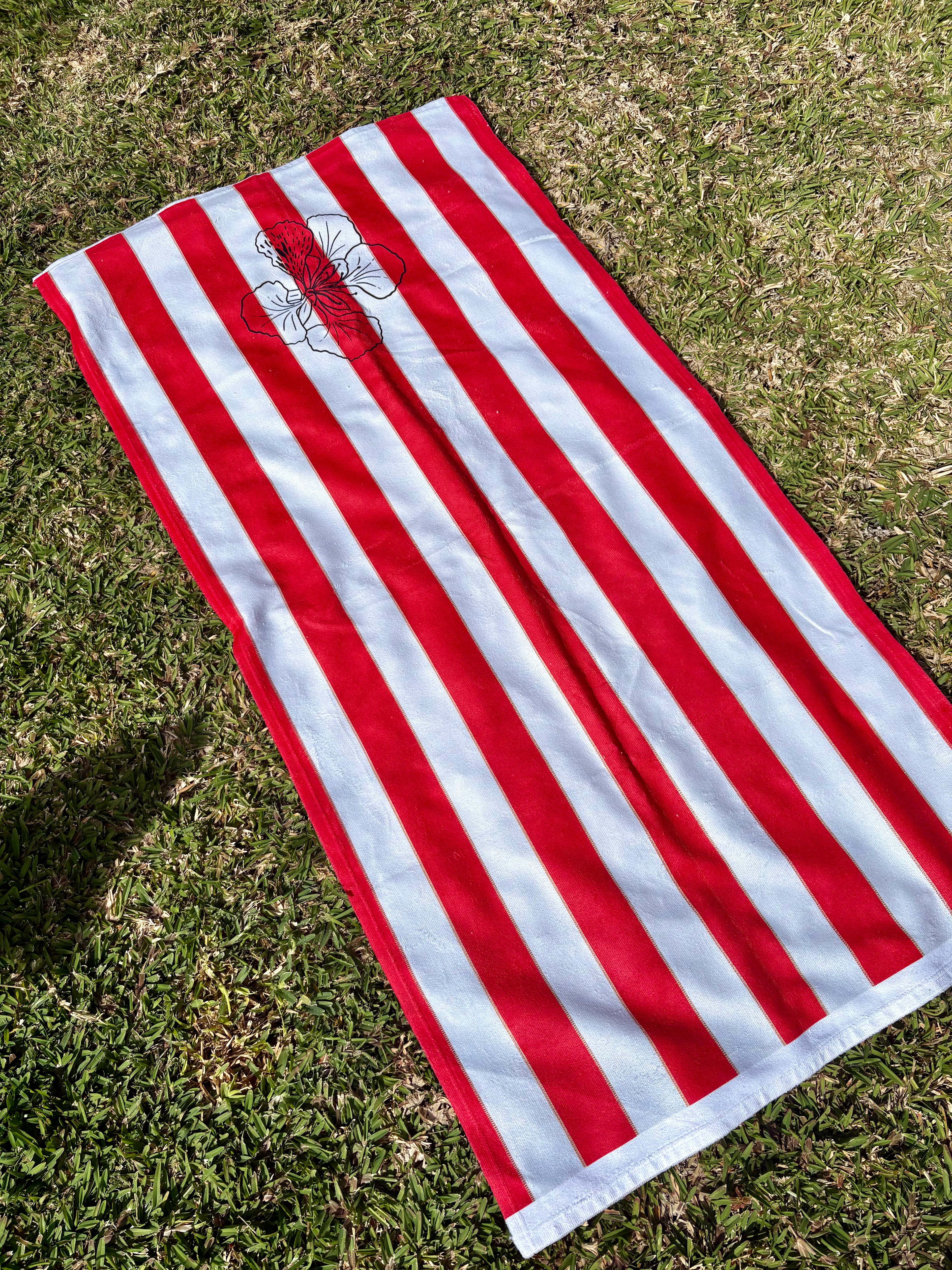 Rouge des îles -- Red Striped Beach Towel with Floral Accent